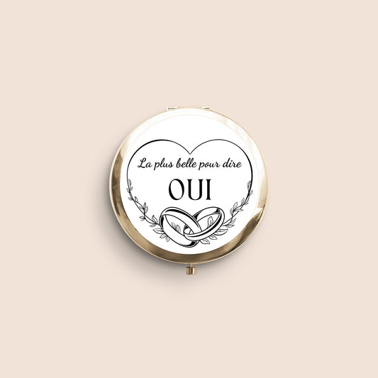 miroir de poche doré avec inscription La plus belle pour dire OUI et alliances